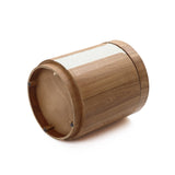 Cylindrical Wood Storage Side Table lies on its side, featuring a white textured strip around part of its circumference.