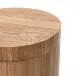 Close-up of a wood storage side table with a smooth, light oak finish, exuding modern elegance.