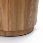 Close-up view of the lower part of a Wood Storage Side Table, highlighting its natural wood grain and texture.