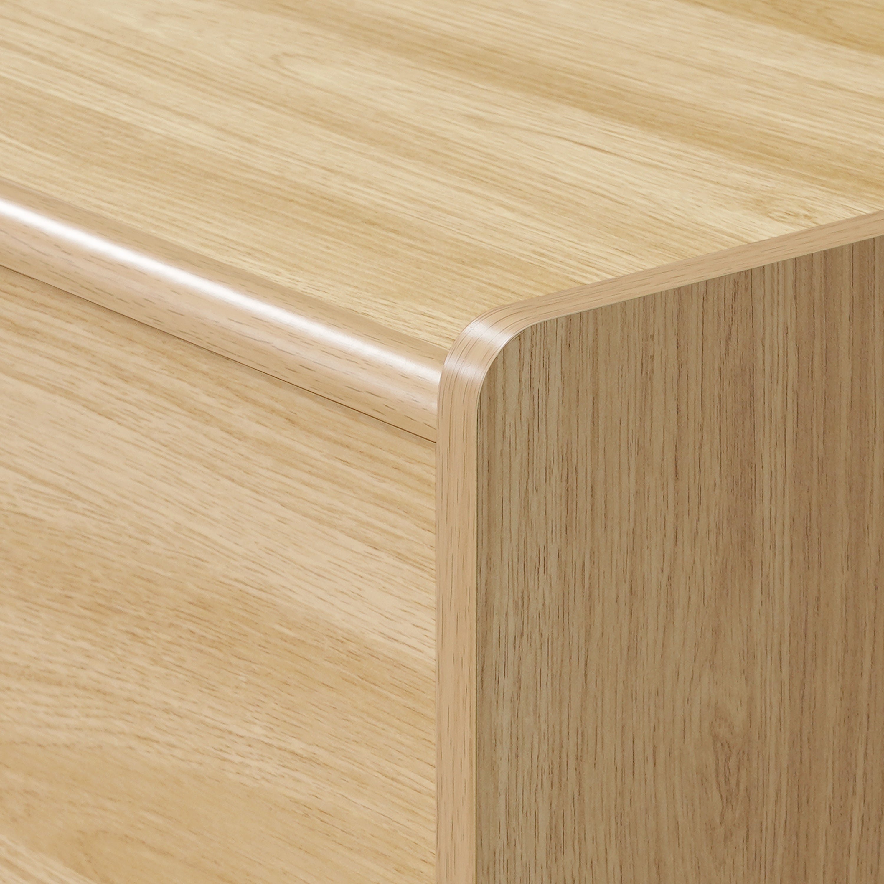 Close-up of a wooden TV console cabinet with smooth, rounded edges and a visible wood grain pattern.