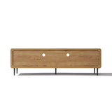 Low wood TV stand with a natural finish, black metal legs, two circular cable management holes on the back panel.