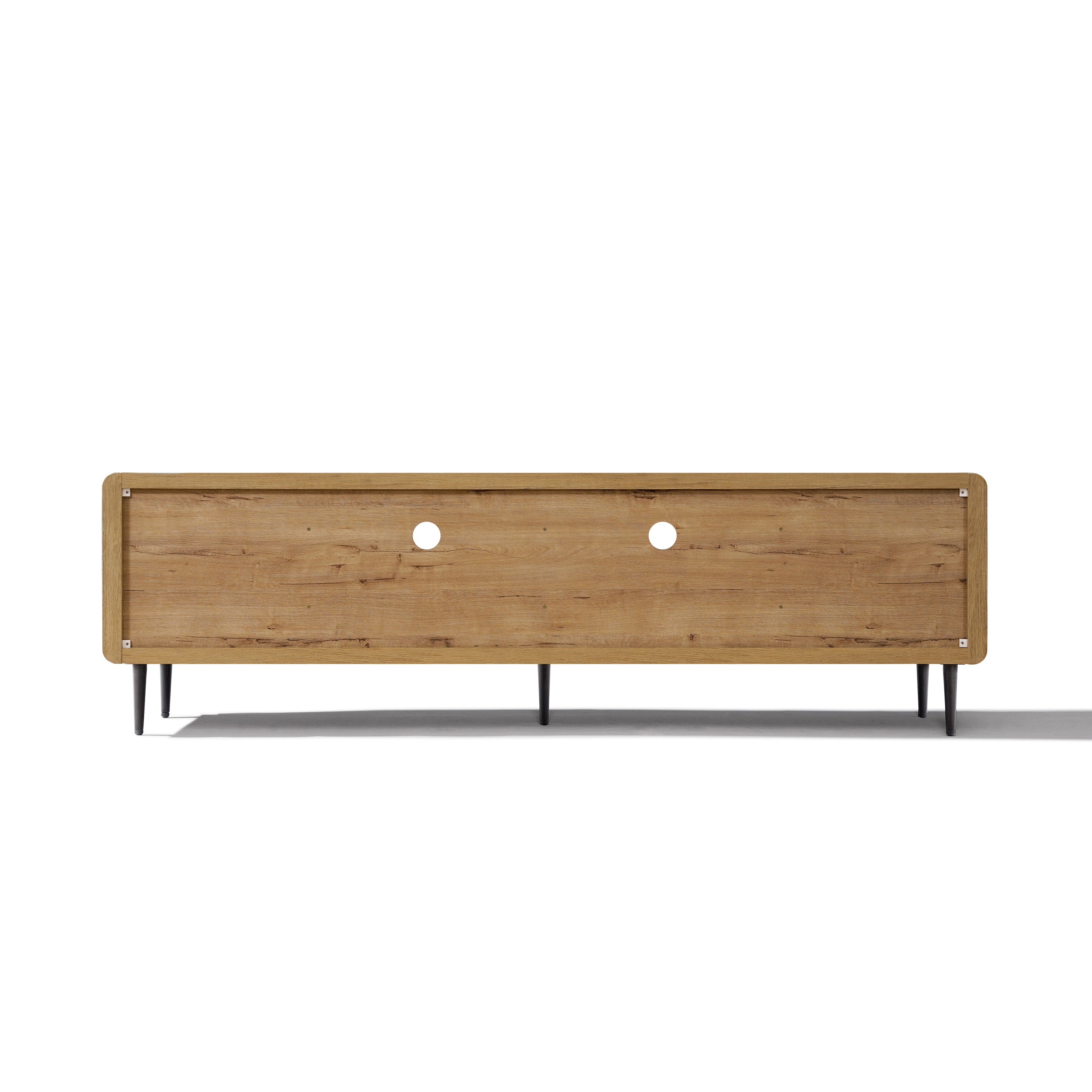 Low wood TV stand with a natural finish, black metal legs, two circular cable management holes on the back panel.