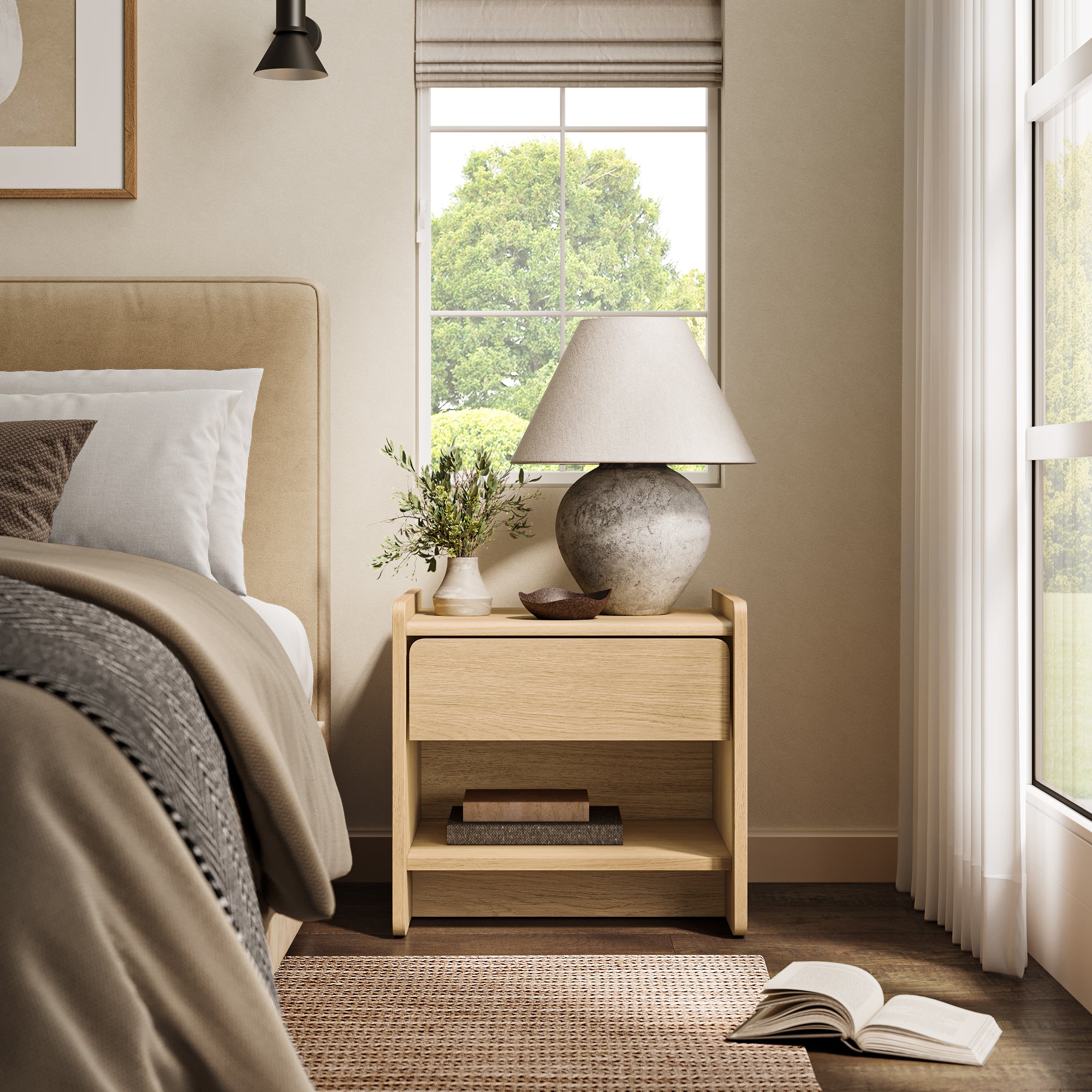A neatly made bed sits beside an oak wood nightstand with a lamp, small plant, and bowl.