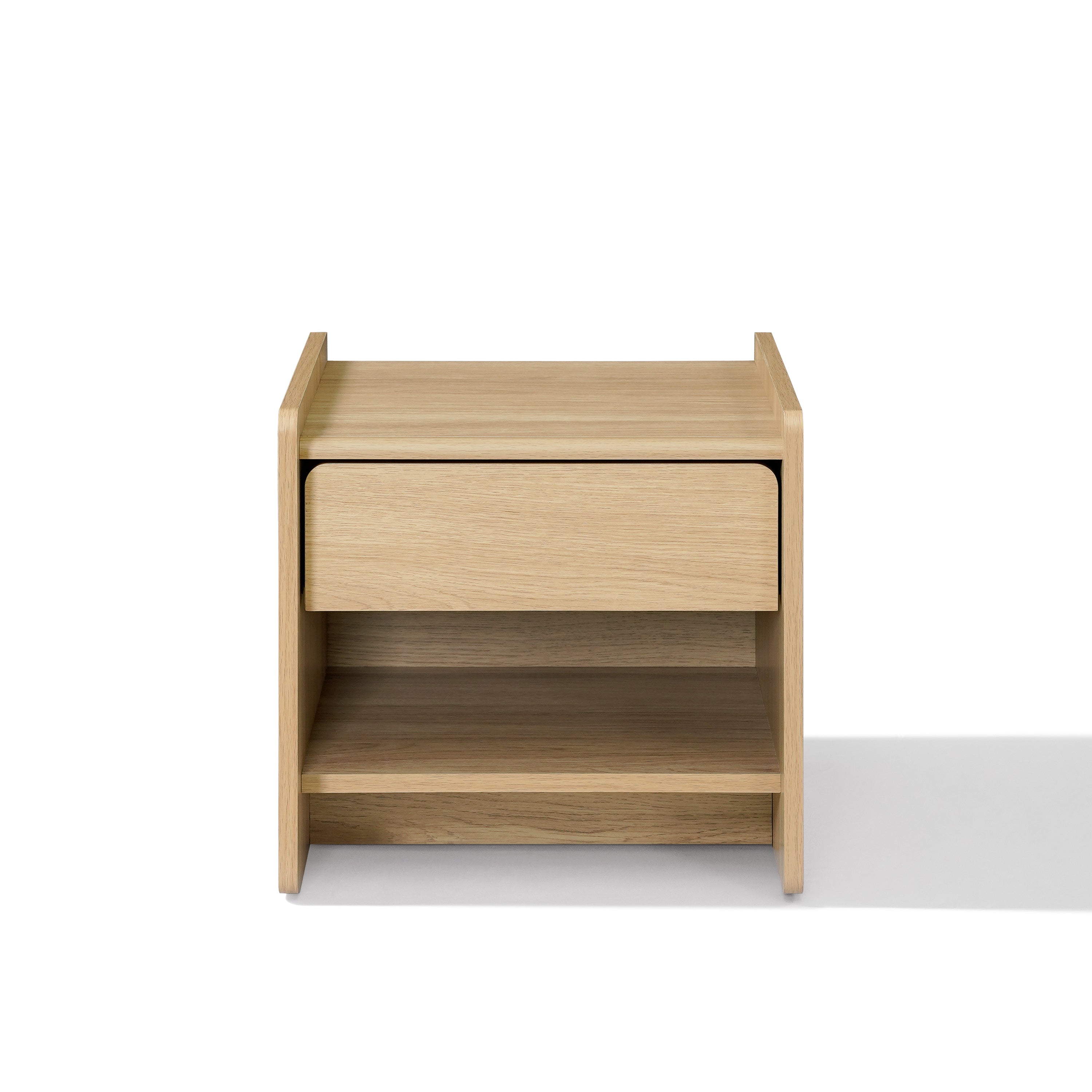 A light oak wood nightstand with a single drawer and an open lower shelf, Scandinavian-Japanese nightstand.
