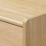 Close-up view of a scandinavian-japanese nightstand with smooth, rounded edges and a simple.