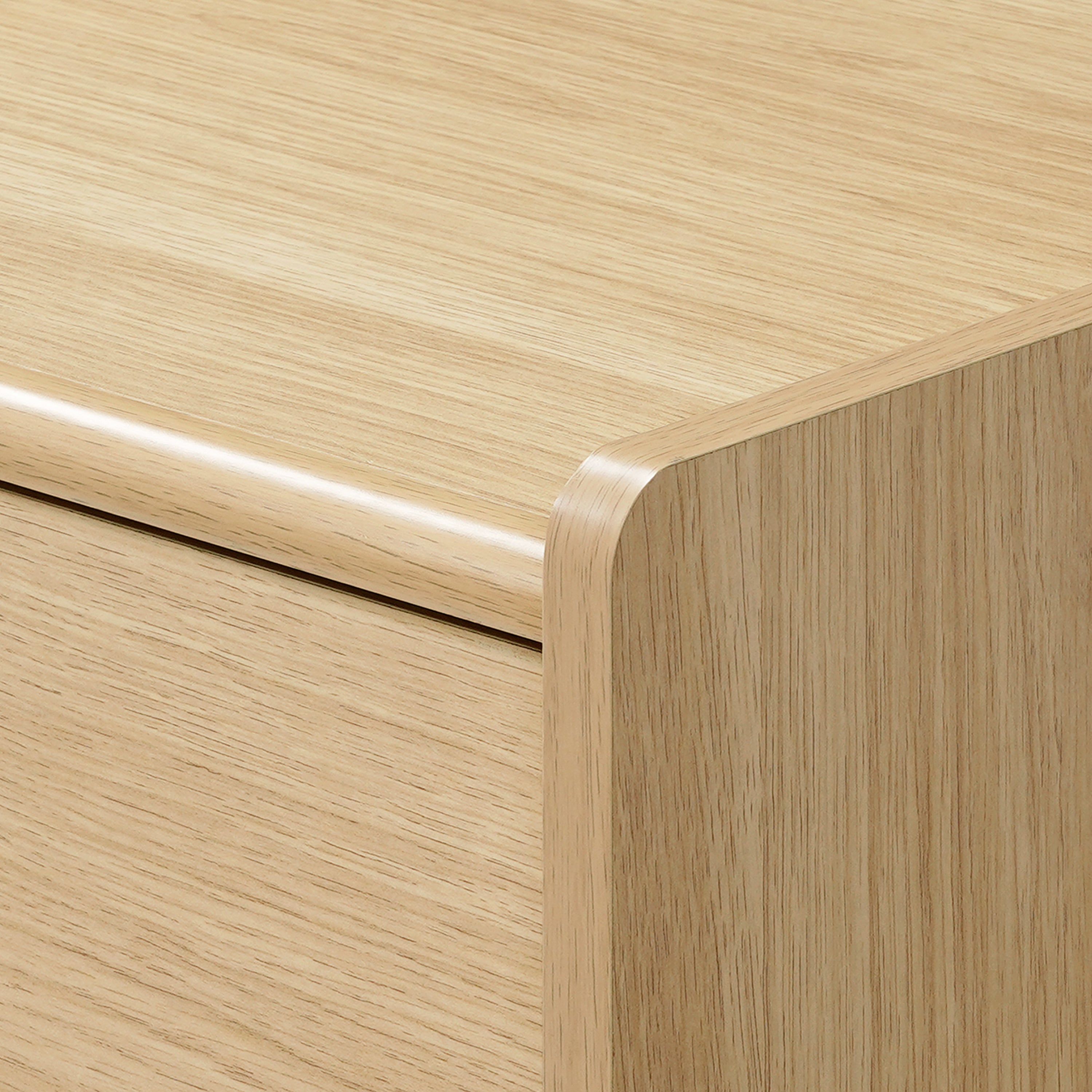 Close-up view of a scandinavian-japanese nightstand with smooth, rounded edges and a simple.