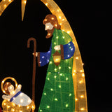 Pre-lit nativity scene holiday decor features standing in green with staff, lantern beside a baby in a manger.