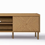 Stylish TV stand featuring open shelving on the left and a geometric-patterned closed cabinet on the right.