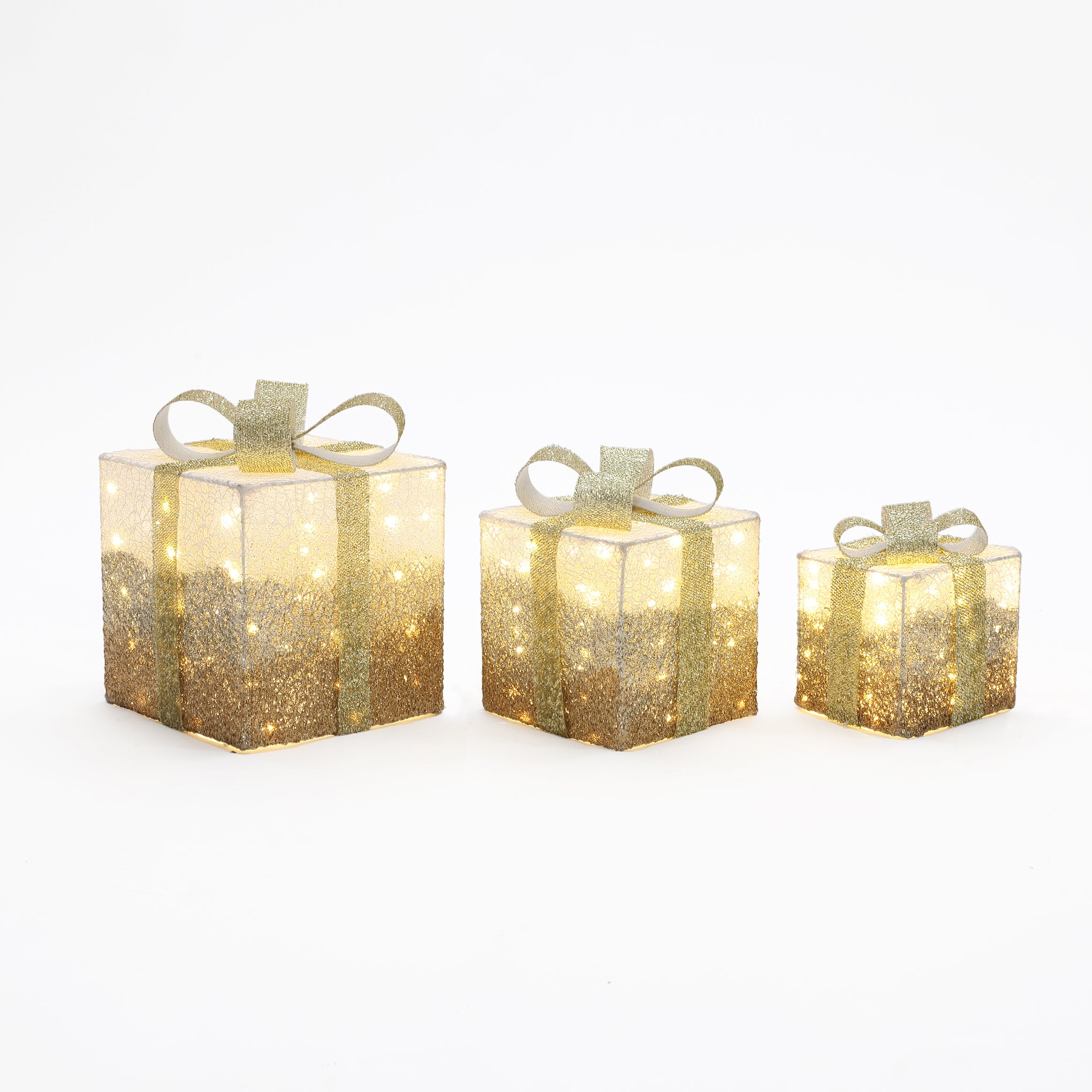 3 illuminated gift boxes with gold glitter, bows are arranged in row from largest to smallest on white background.