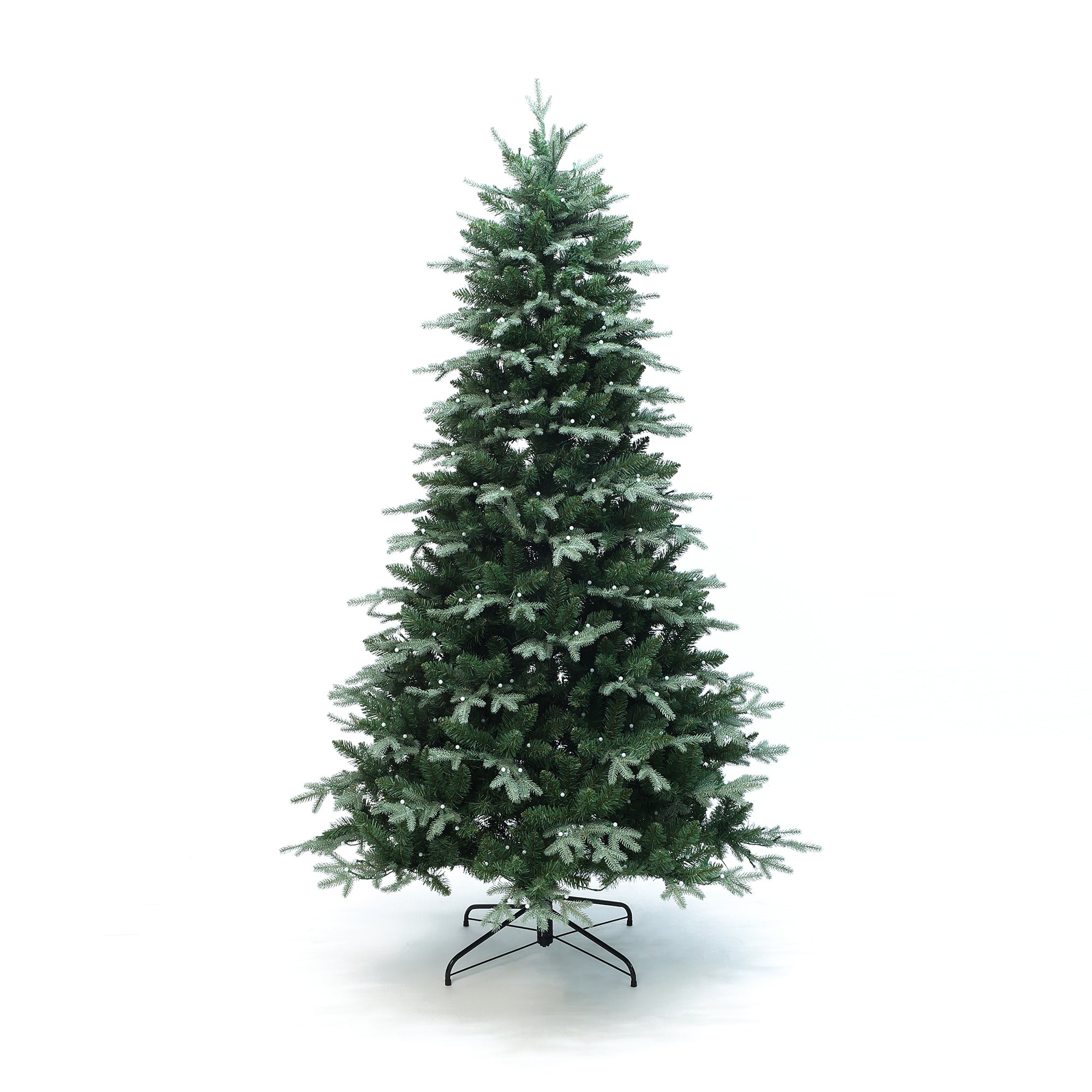 A green pre-lit Christmas tree with a metal stand, standing upright on a white background.