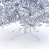 Close-up of the lower branches, metal stand of a 7.5 Foot Silver Artificial Christmas Tree with white string lights..