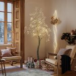 Cozy living room with birch tree glowing softly, wrapped gifts beneath, a chair with blanket. Snow is visible outside.