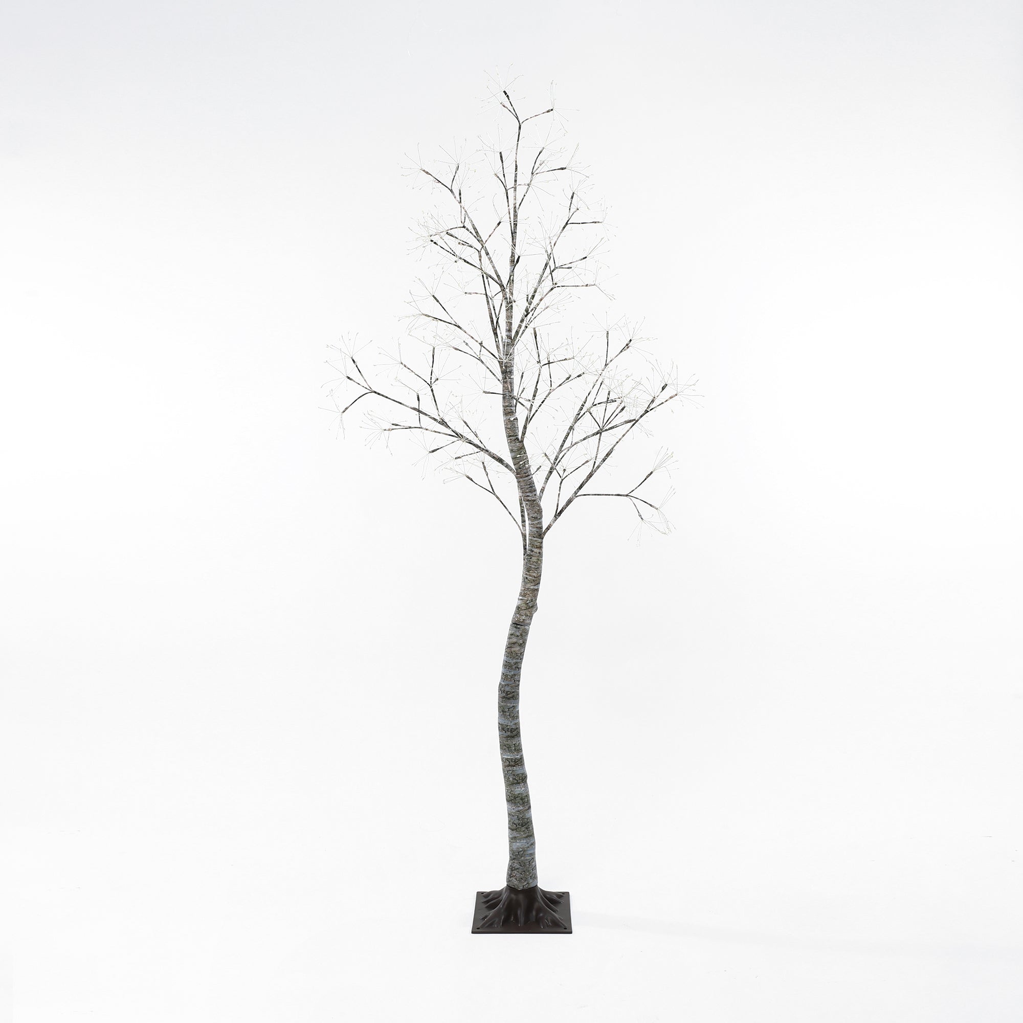 Leafless birch artificial tree with slender trunk, bare branches stands on small square base.