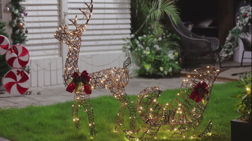 Holiday-Reindeer-pulling-a-sleigh-with-led-lights-red-bows-pinecones-perfect-for-outdoor-area