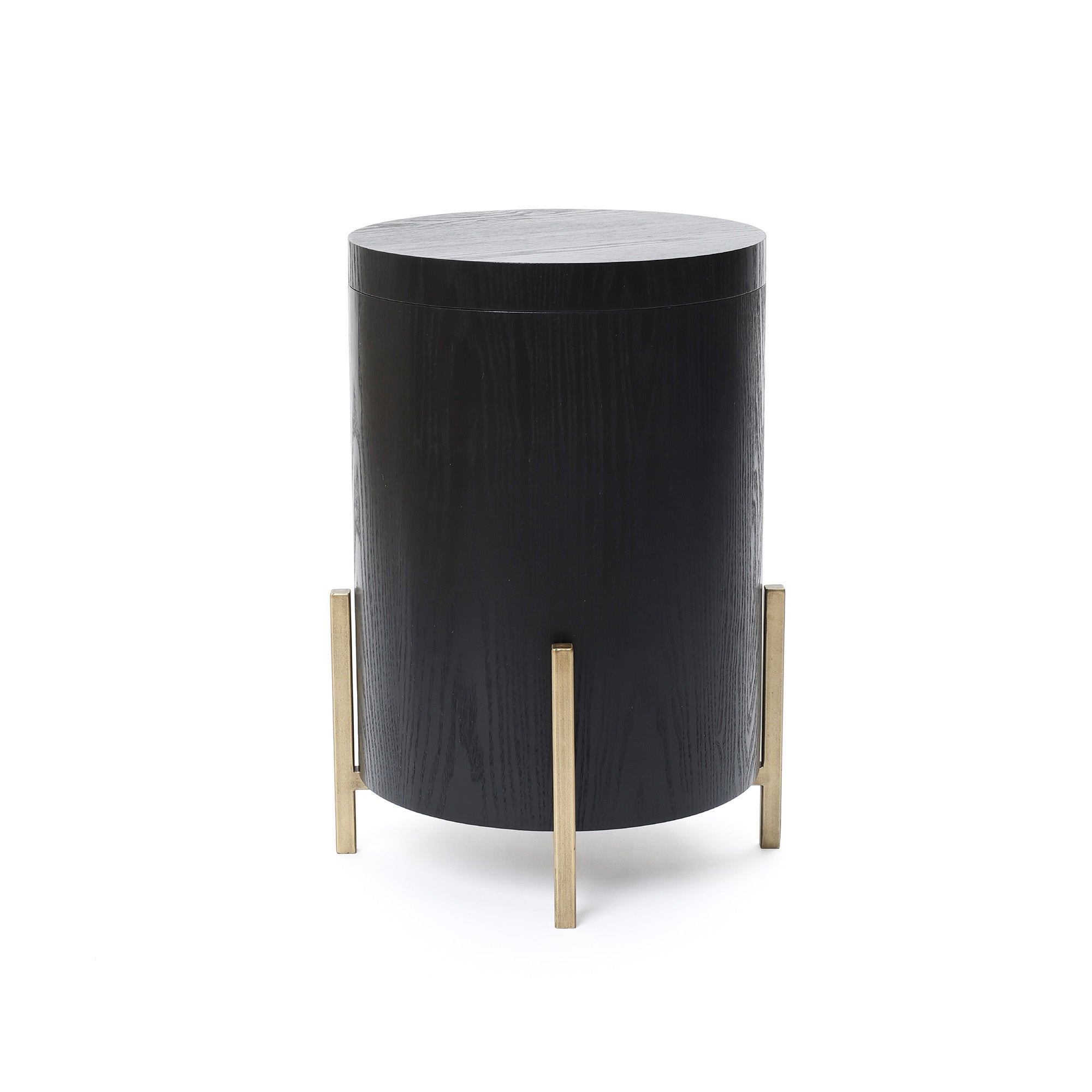 Modern side table featuring a round black top and cylindrical body, supported by four gold metal legs.