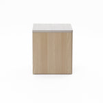 Square wooden box with a light-colored grain texture, closed on all visible sides, set against a plain white background.