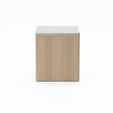 Square wooden box with a light-colored grain texture, closed on all visible sides, set against a plain white background.
