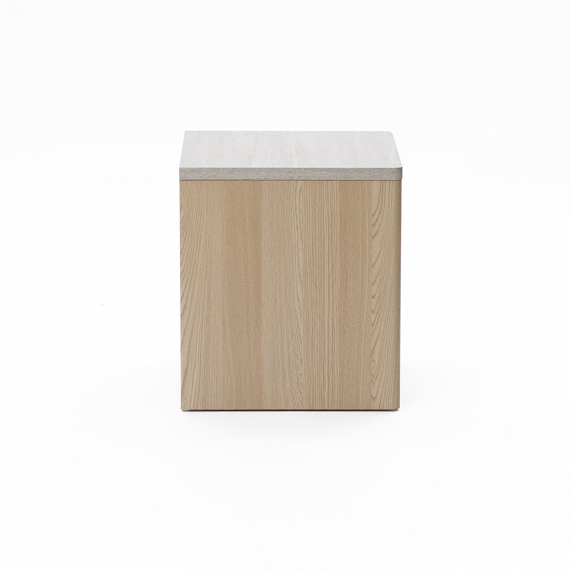 Square wooden box with a light-colored grain texture, closed on all visible sides, set against a plain white background.