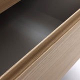 Close-up view of an open modern end table drawer, showing light wood grain texture and empty interior.