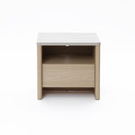 Modern end table in snow oak finish features one open shelf and a closed drawer for storage.
