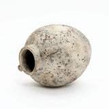 A weathered Terracotta Vase with a wide opening and small handles, displayed on its side against a white background—ideal for rustic farmhouse home décor.
