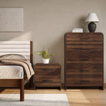 A neatly made bed sits beside a walnut nightstand with a potted plant , perfect for adding warmth.