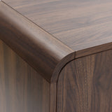 Close-up view of the corner of a wood sideboard cabinet with a smooth, rounded edge and visible wood grain pattern.
