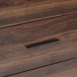 A close-up of a wood storage chest drawer with a dark, horizontal metal handle.