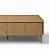 Rectangular Japandi coffee table with sleek legs and a patterned front drawer, offering stylish storage.