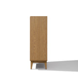 Side view of a modern wood storage cabinet in light oak with a natural finish, standing on four short legs.