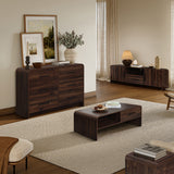 A modern living room features dark wood furniture, including dual-sided storage wooden coffee table, a sideboard, console.