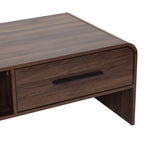 Close-up of a wooden coffee table with a dark finish, featuring a black handle on the drawer.