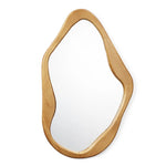 Irregularly shaped mirror with a wooden frame, featuring smooth curves and a natural, organic finish, mounted against a plain background.