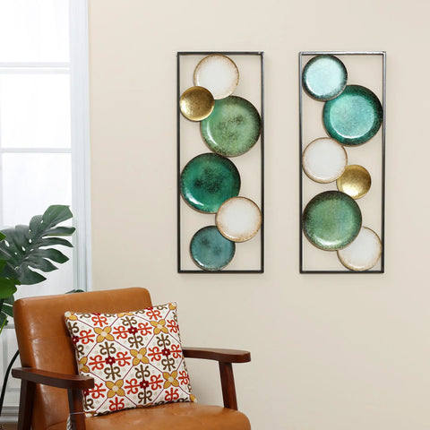 two-decorative-plates-and-a-pillow-hanging-on-a-wall