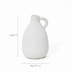This white speckled ceramic jug, reminiscent of a vintage vase, features a handle and measures 6.89 inches in height and 5.71 inches in diameter, making it an ideal piece for home decor.