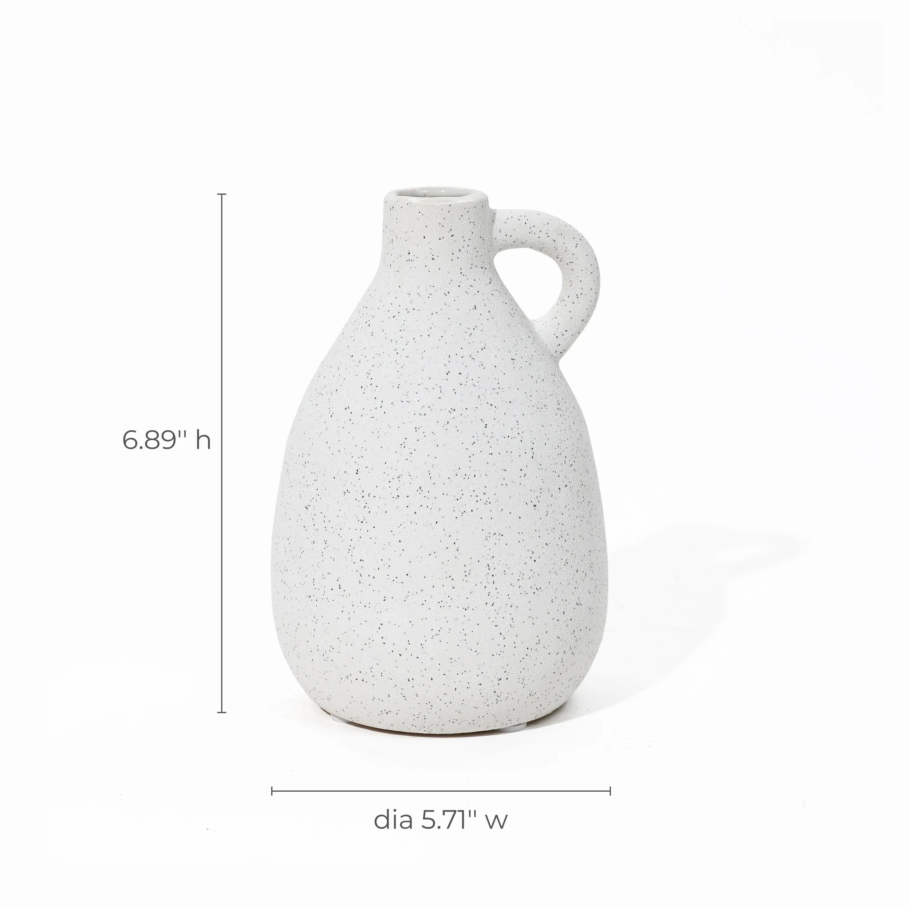 This white speckled ceramic jug, reminiscent of a vintage vase, features a handle and measures 6.89 inches in height and 5.71 inches in diameter, making it an ideal piece for home decor.