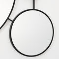 black-circular-mirror-and-black-rope-on-a-white-background