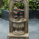 vintage-style-arched-cement-urn-with-metal-flowers-outdoor-fountain