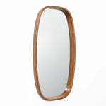 The Jean wood frame rounded rectangle wall mirror by LuxenHome adds a minimalist touch, enhancing the contemporary look of a white wall.