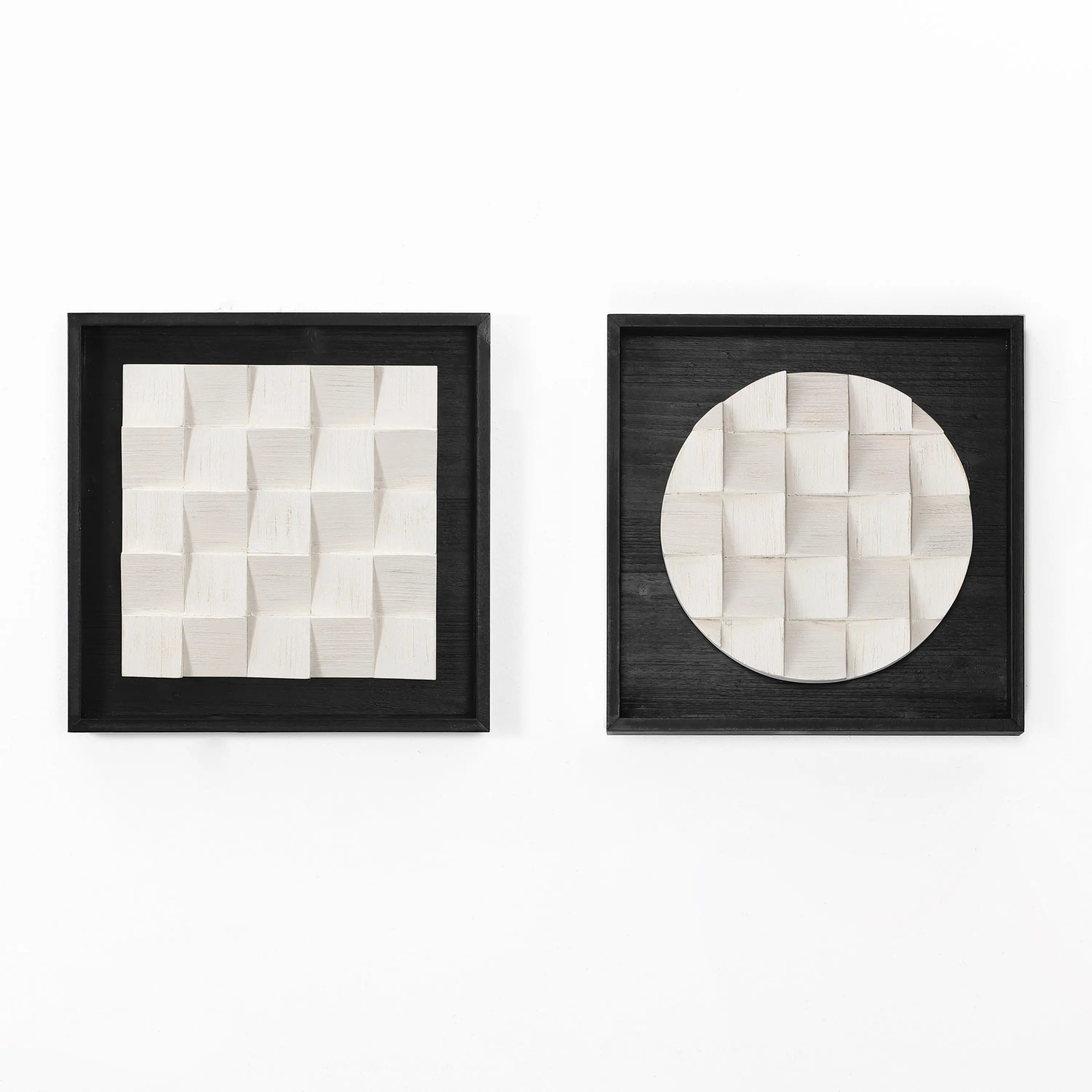 Two black-framed geometric artworks adorn the white wall, each exuding abstract artistic charm. One showcases a square pattern, the other a circular one, both with a textured, woven appearance that brings in a subtle 3D effect as minimalist modern wall hangings.