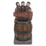 rustic-fountain-with-three-wine-bottles-pouring-into-a-wine-barrel