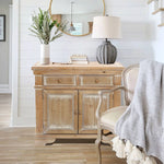 This-natural-distressed-wood-finish-and-white-accents-storage-cabinet-adds-extra-storage-to-any-room