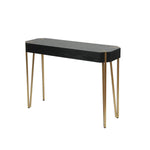 A rectangular black wooden console table featuring four slender gold metal hairpin legs, perfect for adding a touch of modern design to any space.