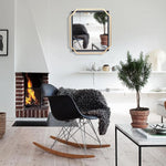modern-style-gold-and-black-metal-frame-wall-mirror-in-living-room