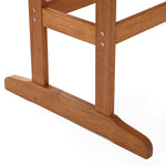 wooden-chair-with-a-long-wooden-seat-and-back-and-a-short-wooden-seat-rail-the-legs-are-connected-by-a-metal-brace 
