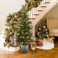 display-pre-lit-snow-flocked-small-christmas-tree-with-lights-beside-the-stairs