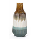 A unique vase with a tall, ribbed ceramic design showcases gradient colors: rich brown at the top, transitioning elegantly to white and finishing with teal at the bottom.