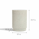 This cylindrical speckled stool, crafted from cement material, stands 17.7 inches high and 13 inches wide. Its textured surface and ivory white color make it a versatile side table addition to any space.