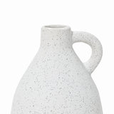 Close-up of a speckled white ceramic vase with a rounded body and a single curved handle on a white background. This vintage vase brings an elegant touch to any home decor, offering timeless charm and style.