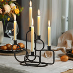 black-candelabra-and-candles-on-a-dining-table
